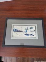 Framed watercolor on tabletop