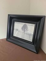Framed snowscape print angled view