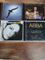 Front covers of four CD albums