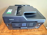 Oblique view of Brother MFC-J6530DW printer showing front panel, paper tray and ADF