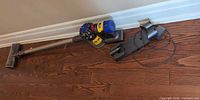 Vacuum, motorized head, dock and charger on floor