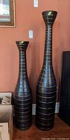 Full view of both vases standing side by side
