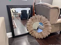 Both mirrors leaning against furniture showing size and design