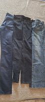 Three pairs of jeans side by side