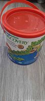 Front of Imaginarium Discovery bucket with red lid