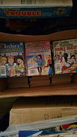 Box with stacks of Archie and Betty & Veronica Double Digest comics