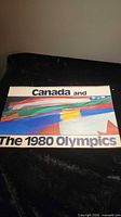 Front cover reading "Canada and The 1980 Olympics" showing spiral binding