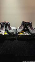 Both pairs of Fischer XC Sport Thinsulate ski boots on their boxes