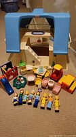 Overall view of dollhouse, figures and accessories