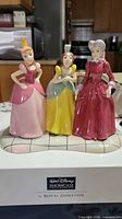 Front view of Royal Doulton Terrible Trio figurine on box