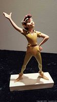 Front view of Peter Pan figurine on base