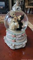 Front view of Mickey & Minnie wedding musical snow globe