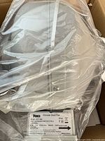 Fan inside plastic wrap showing top and housing