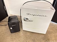 Frigidaire mini fridge and Admiral cooler side-by-side, showing exterior condition