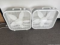Both Lasko box fans front view