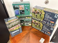 Group shot of five visible lighting boxes on table