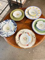 Assorted plates and bowls arranged on table