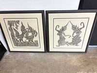 Both framed Thai dancer prints standing side by side