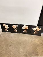 All four framed canvas panels side by side