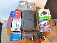 Group shot of console, controllers, games, accessory boxes