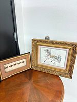 Both framed artworks together for size and style reference