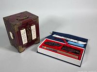 Jewelry box and open fan presentation box with contents