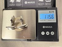 Cufflinks on scale showing 11.56 g