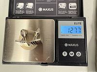 cufflinks on scale showing 12.77 g total weight