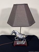Full view lamp unlit showing shade, horse base, cord