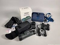 Entire lot displayed: Gosky monocular, accessories, box, Bushnell and Vivitar binoculars, shared Image case