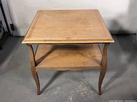 Front view of oak end table with lower shelf