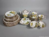 Complete set showing plates, teapot, divided dish, cups, saucers and sweet-meat dishes