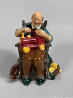 Front view of Royal Doulton The Toymaker figurine