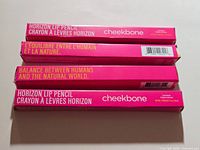 Four boxed lip pencils front view with branding and bilingual text visible
