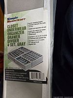 Front of sealed Simple Houseware 4-piece drawer divider package showing product name and compartment image