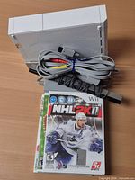 Console, cables and three game cases overview