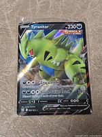 Front view of Tyranitar V Battle Styles card in sleeve