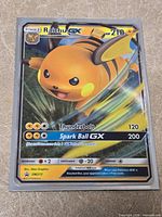 Front view of Raichu GX card showing holographic artwork and stats