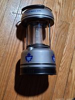 Lantern removed from box showing logo and handle