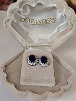 earrings displayed in open Ostrander branded velvet box