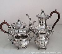 full view of all four silver-plated pieces