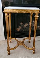 Full view of gilt wood side table with marble top