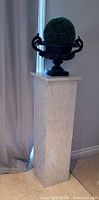Pedestal with urn on top (urn not included) showing front view