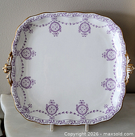 Front view of square handled dessert plate showing full pattern