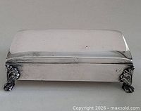 Top view showing rectangular silver-plated box with hinged lid