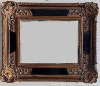 Front view of ornate gilt wood mirror