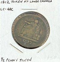 Token in holder with handwritten ID showing obverse