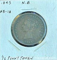 Obverse of 1843 New Brunswick half penny token in holder