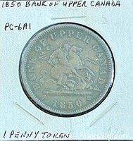 Obverse of 1850 Bank of Upper Canada penny token in holder