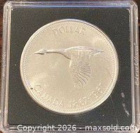 Reverse of coin showing Canada goose and dates